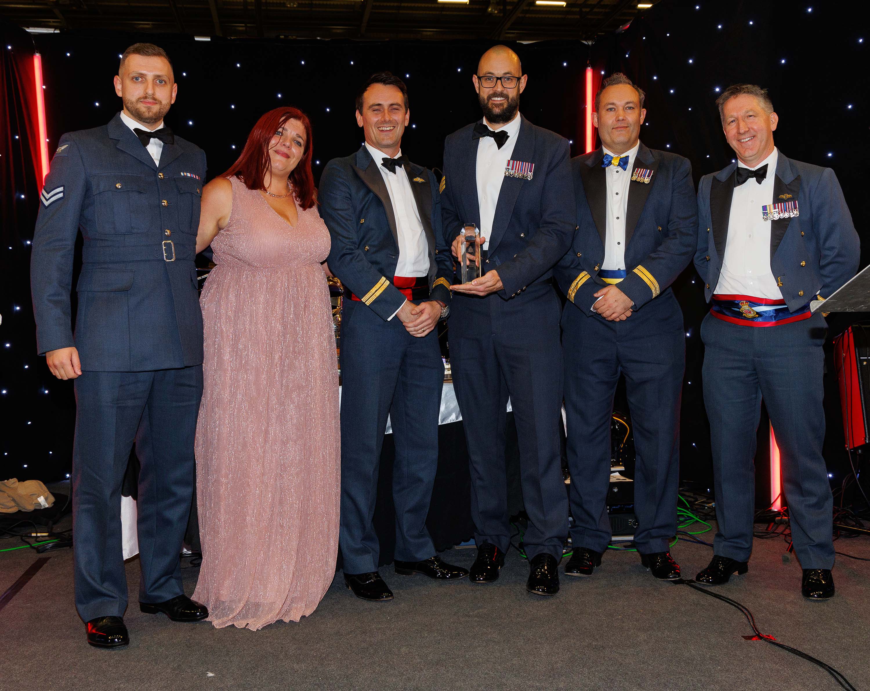 Photo: Shows the A400M Low Level Para Prep Team and Flight Lieutenant Tippett having won the Commander Air Wing’s Award